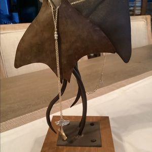 Lariat necklace in gold and silver tones